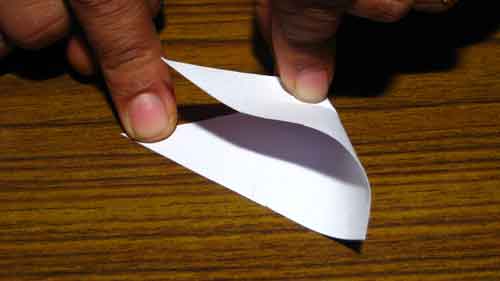 Fold triangular paper to shape your bookmark